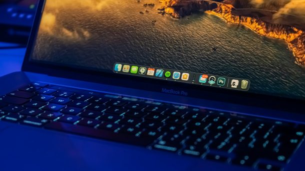 black laptop computer turned on displaying desktop icons