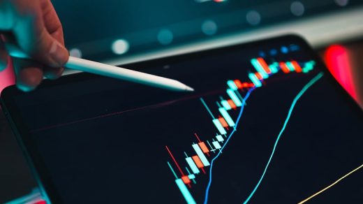Close-up of cryptocurrency trading analysis on a digital tablet, highlighting market trends.